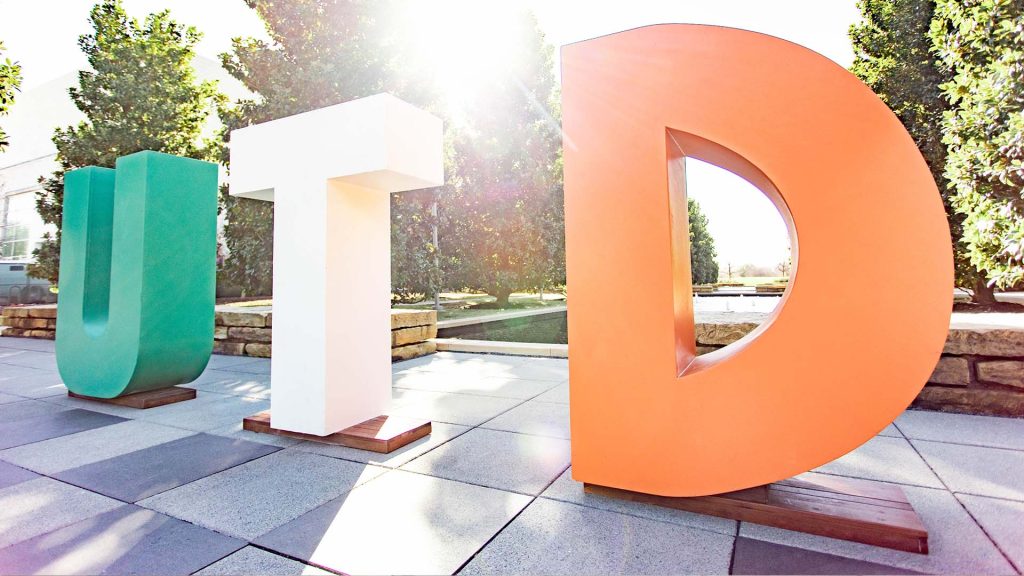 UTD letters displayed on the campus mall